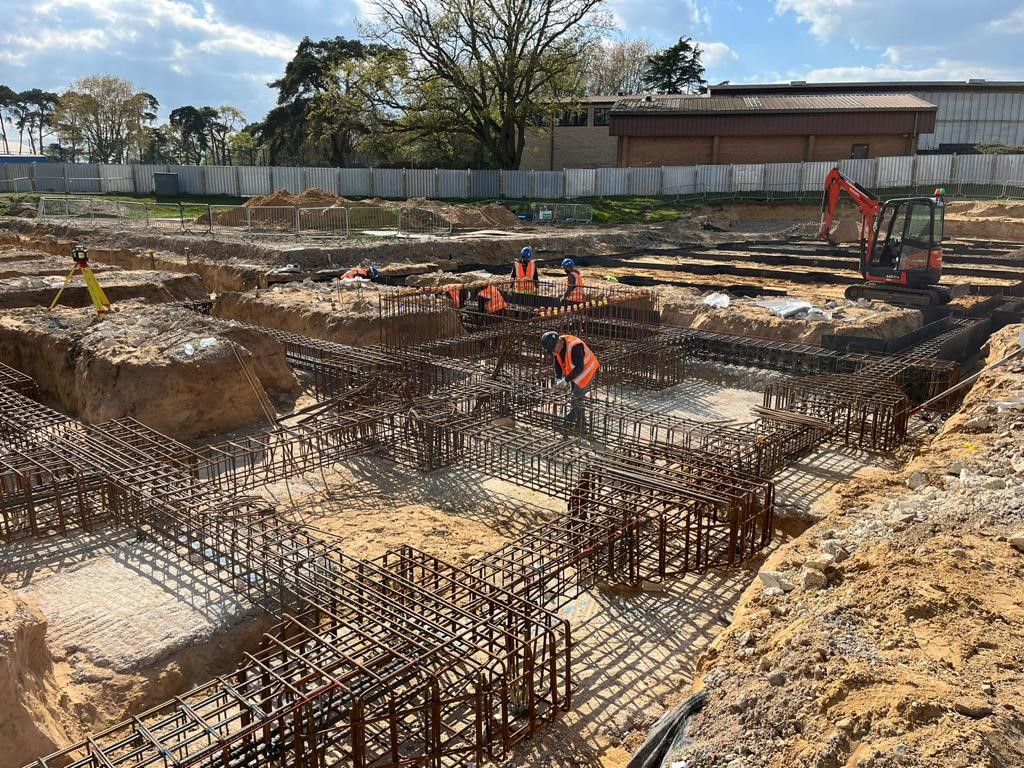 Construction of new dormitory buildings with associated drainage and external works